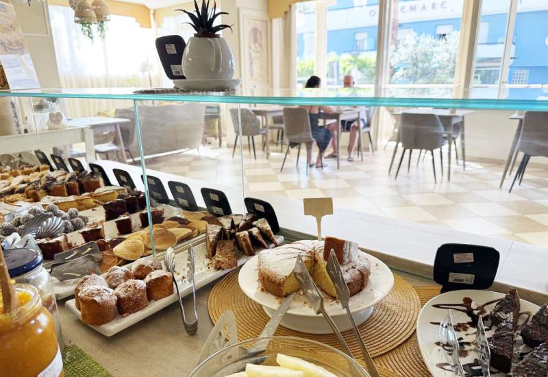 Display of delicious pastries in a bright and cozy café.